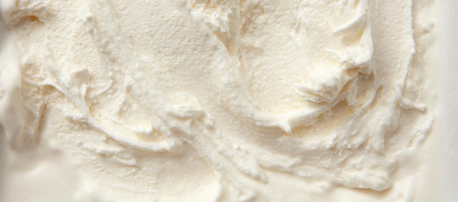 Photo by DS stories High-resolution close-up of smooth vanilla ice cream texture, perfect for food bloggers and culinary projects.